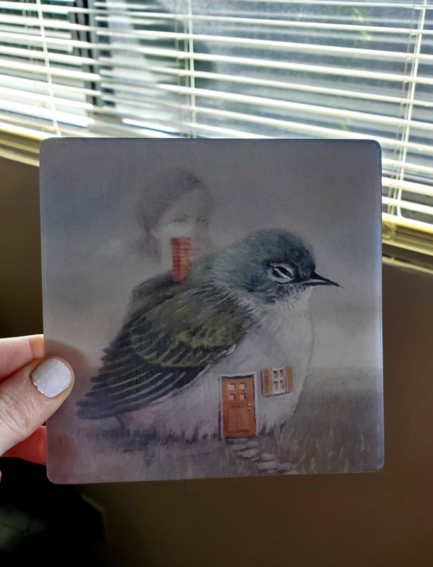 Lenticular print, side 2. Birdhouse. (surreal image of a bird with a house inside its belly)